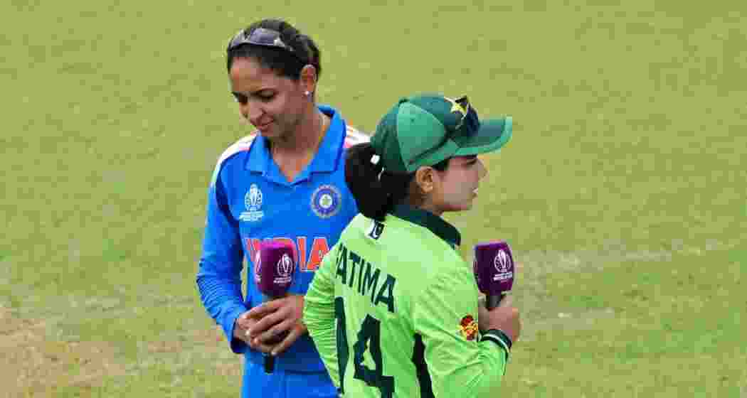 India captain Harmanpreet Kaur and her Pakistani counterpart Fatima Sana walk past after the toss ahead of the Women’s ODI World Cup 2025 match. India captain Harmanpreet Kaur and her Pakistani counterpart Fatima Sana walk past after the toss ahead of the Women’s ODI World Cup 2025 match.