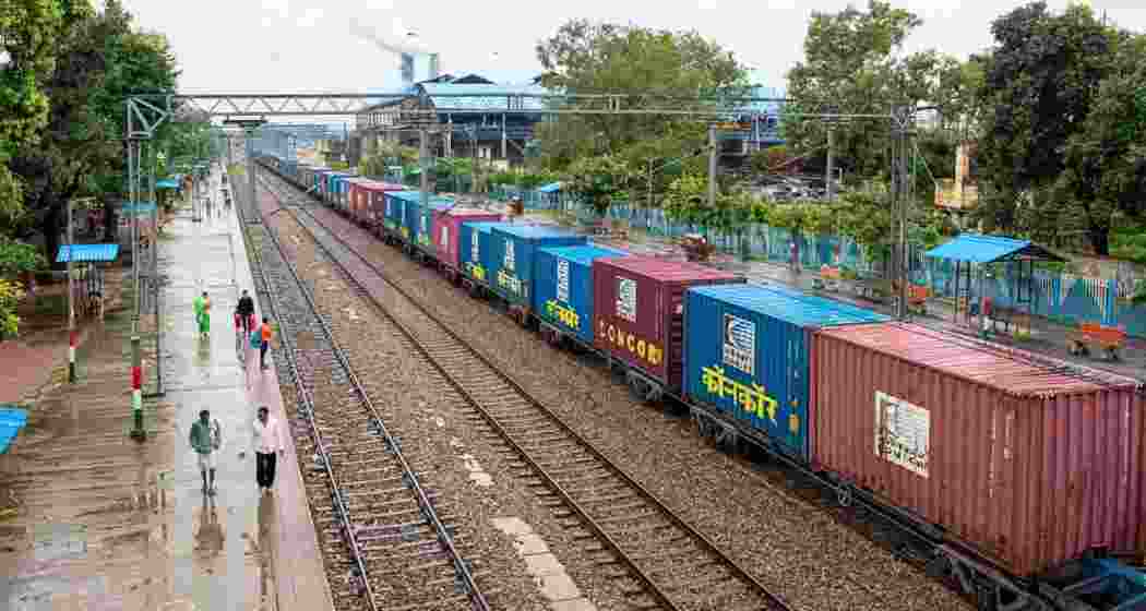 A cargo train stationed at a railway platform. A cargo train stationed at a railway platform.