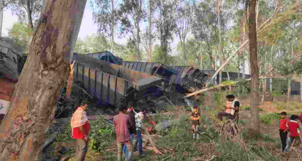 Locals inspect the debris after a collision between two NTPC-operated goods trains in Jharkhand’s Sahebganj district, which resulted in the deaths of two drivers and left four others injured. Locals inspect the debris after a collision between two NTPC-operated goods trains in Jharkhand’s Sahebganj district, which resulted in the deaths of two drivers and left four others injured.