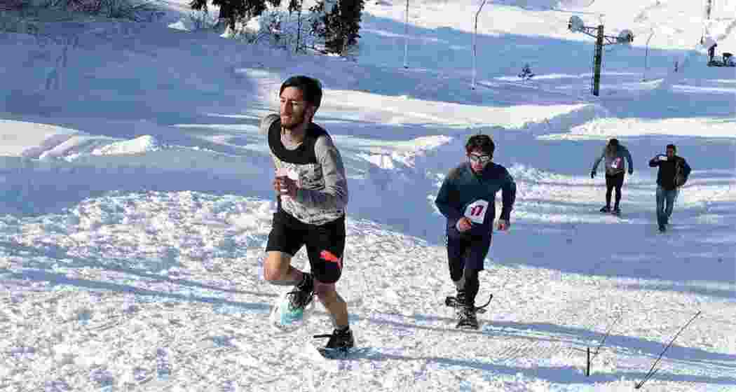 Participants in action during the Jammu and Kashmir Snow Shoe Association's season opener snowshoe race at Mammoth Meadow, Dara Srinagar, January 12, 2024. Participants in action during the Jammu and Kashmir Snow Shoe Association's season opener snowshoe race at Mammoth Meadow, Dara Srinagar, January 12, 2024.