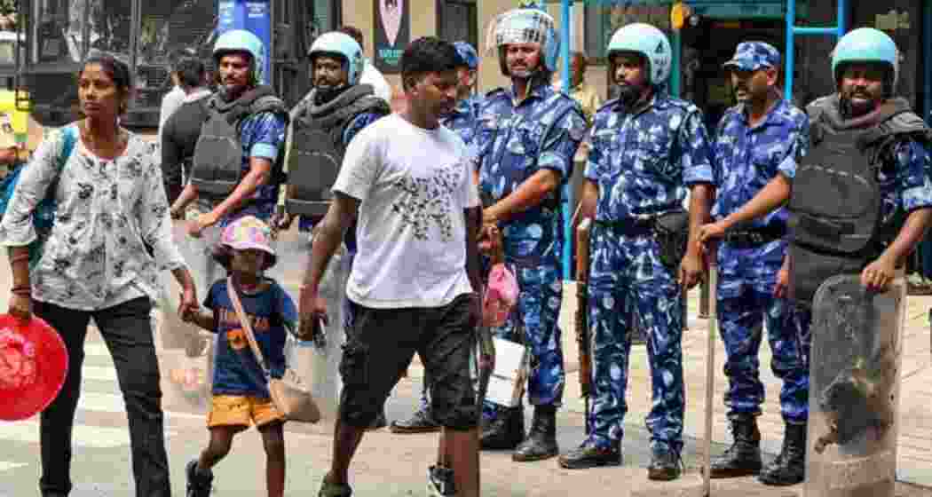 Rapid Action Force (RAF) personnel stand guard during a ’bandh’ called by farmers and Kannada organisations against the release of Cauvery river water to Tamil Nadu from dams in Karnataka, in Bengaluru, Tuesday, Sept. 26, 2023. The state is observing a bandh from 6 am to 6 pm on Saturday, March 22. 2025. Rapid Action Force (RAF) personnel stand guard during a ’bandh’ called by farmers and Kannada organisations against the release of Cauvery river water to Tamil Nadu from dams in Karnataka, in Bengaluru, Tuesday, Sept. 26, 2023. The state is observing a bandh from 6 am to 6 pm on Saturday, March 22. 2025.