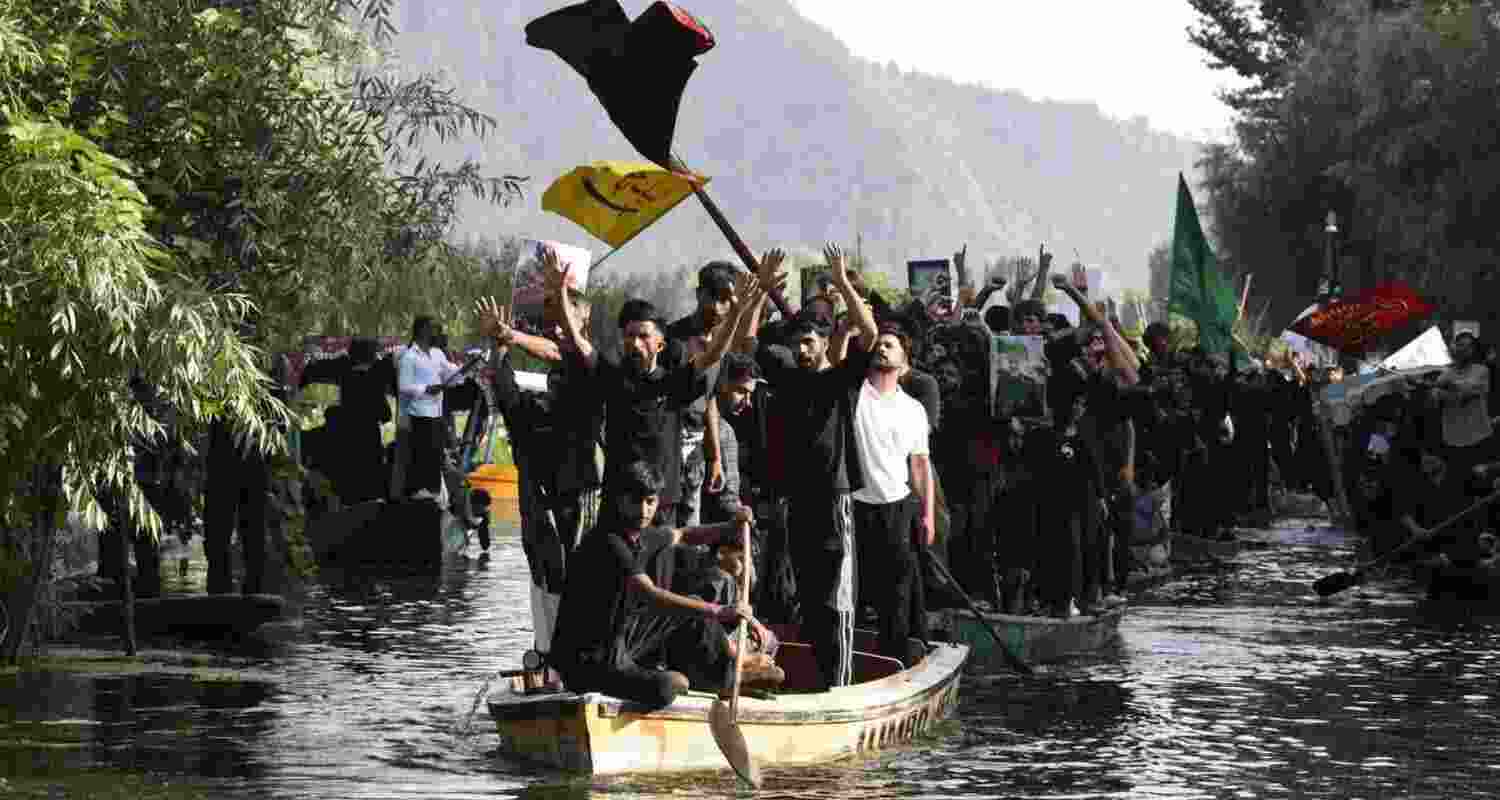 Kashmiri Shiite mourners during the procession in the interiors of Dal Lake in Srinagar. Kashmiri Shiite mourners during the procession in the interiors of Dal Lake in Srinagar.