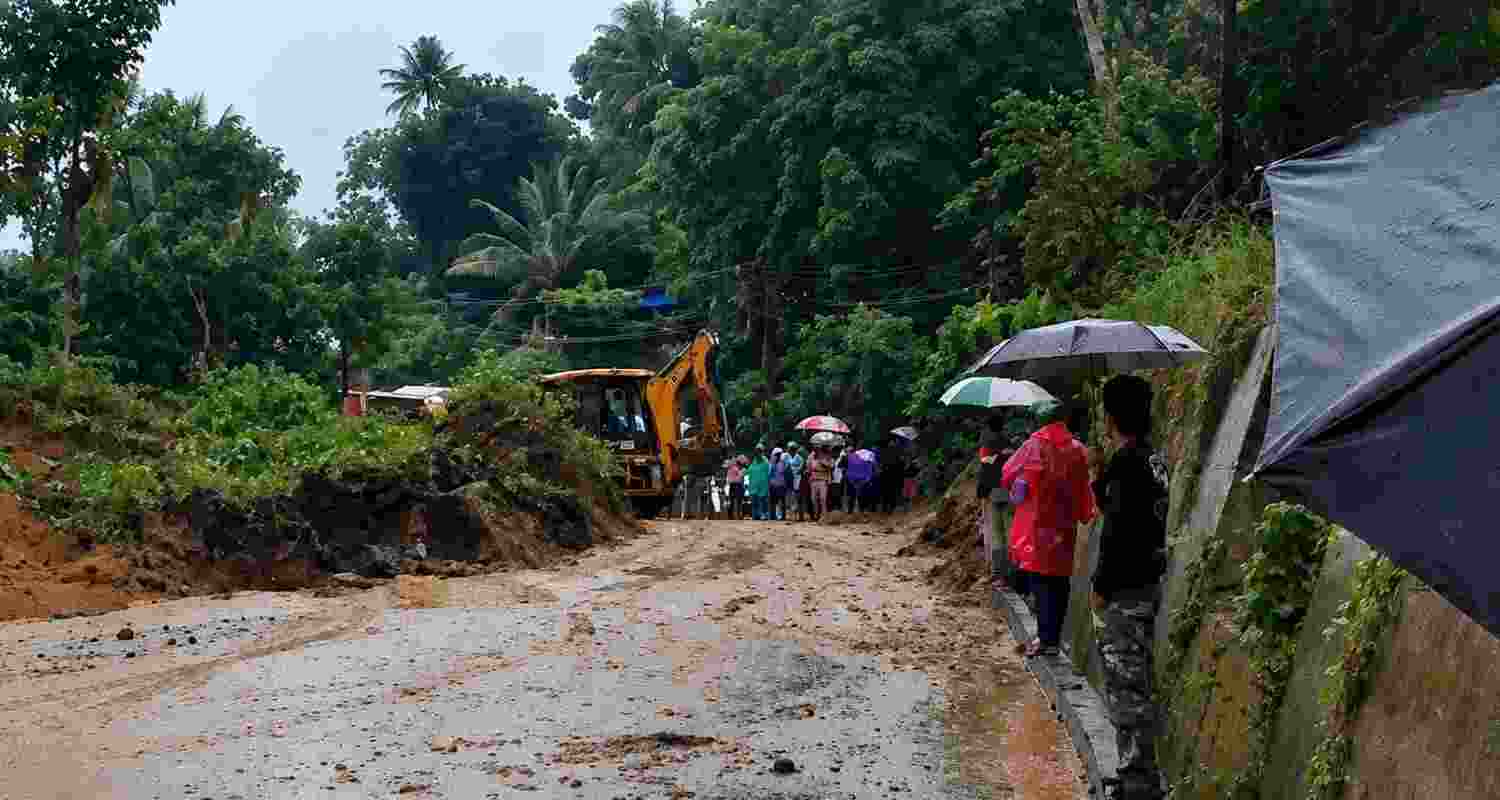 One person died and another is feared trapped after landslides hit Keralam's Idukki district, while the IMD issued red alerts for heavy rain and storms. One person died and another is feared trapped after landslides hit Keralam's Idukki district, while the IMD issued red alerts for heavy rain and storms.