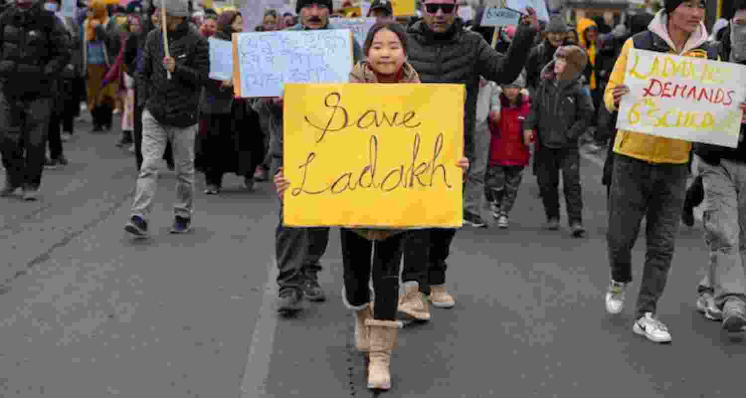 A child carries a sign during Ladakh Sixth schedule protests. A child carries a sign during Ladakh Sixth schedule protests.