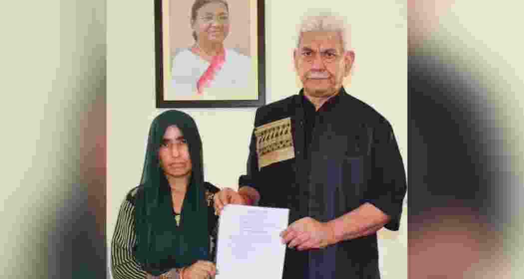Lieutenant Governor Manoj Sinha presenting the appointment letter to Smt. Renu Sharma, the widow of Sh. Vijay Kumar, who was killed in the Reasi bus attack. Lieutenant Governor Manoj Sinha presenting the appointment letter to Smt. Renu Sharma, the widow of Sh. Vijay Kumar, who was killed in the Reasi bus attack.
