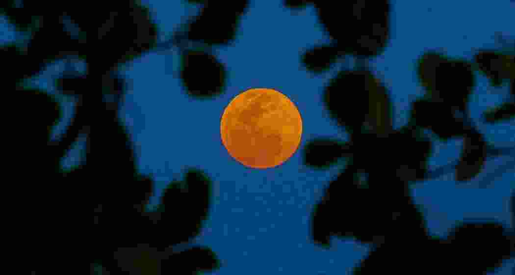 The Moon glows crimson during a total lunar eclipse. The Moon glows crimson during a total lunar eclipse.