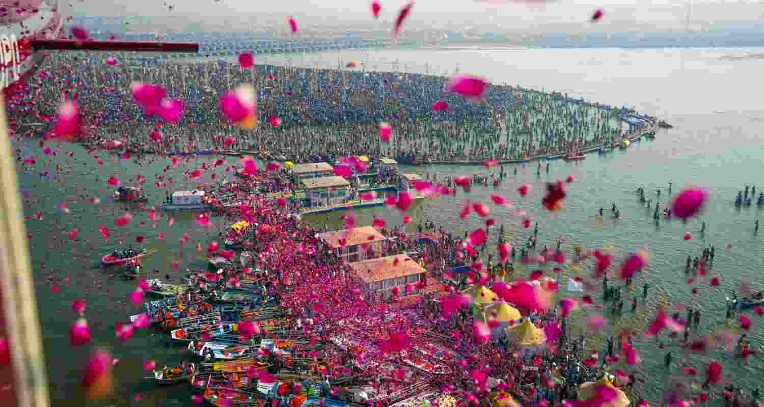 Flower petals being showered at devotees during the Mahakumbh at the Triveni Sangam in Prayagraj. Flower petals being showered at devotees during the Mahakumbh at the Triveni Sangam in Prayagraj.