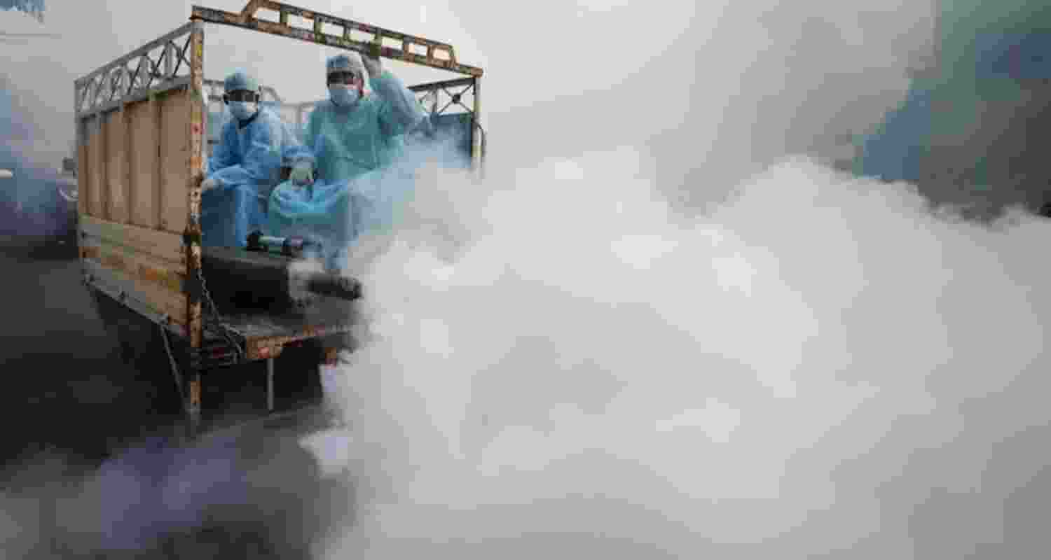 Municipal workers carry out fumigation to prevent the spread of malaria - file image. Municipal workers carry out fumigation to prevent the spread of malaria - file image.