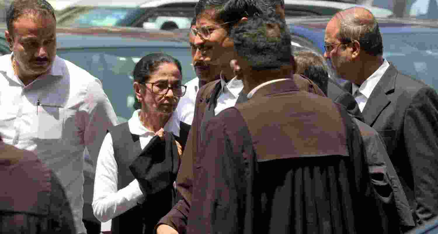 Mamata Banerjee appeared at Calcutta High Court in lawyer’s robes amid a TMC plea over alleged violence linked to BJP-backed miscreants. Mamata Banerjee appeared at Calcutta High Court in lawyer’s robes amid a TMC plea over alleged violence linked to BJP-backed miscreants.