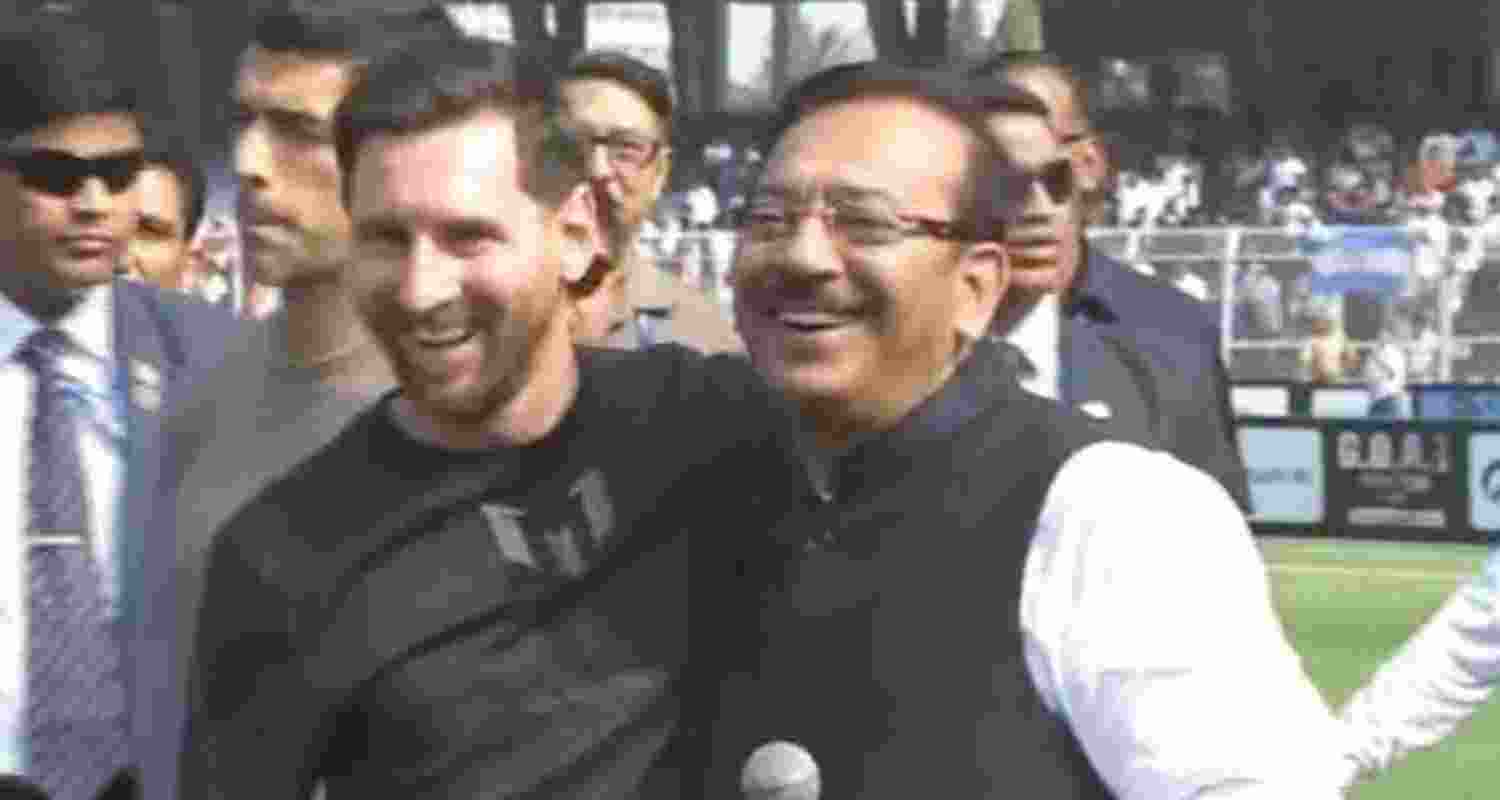 Lionel Messi to former state Sports Minister Arup Biswas. Lionel Messi to former state Sports Minister Arup Biswas.