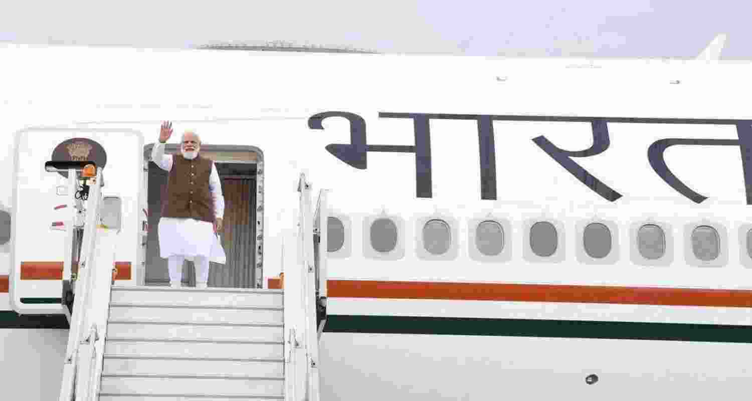 PM Modi boarding a plane earlier this year. FIle Photo, PM Modi boarding a plane earlier this year. FIle Photo,