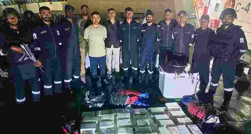 Gujarat ATS and Indian Coast Guard personnel display the seized cocaine following a joint anti-narcotics operation off the Gujarat coast near Mundra port. Gujarat ATS and Indian Coast Guard personnel display the seized cocaine following a joint anti-narcotics operation off the Gujarat coast near Mundra port.