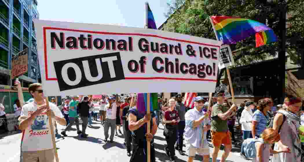 Marchers at a Labor Day rally in Chicago protested President Trump's threatened National Guard deployment. Marchers at a Labor Day rally in Chicago protested President Trump's threatened National Guard deployment.