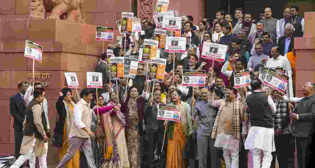 NDA members stage a protest demanding an apology from the opposition Congress for allegedly insulting Ambedkar, at Parliament premises, in New Delhi on Thursday, Dec. 19, 2024. NDA members stage a protest demanding an apology from the opposition Congress for allegedly insulting Ambedkar, at Parliament premises, in New Delhi on Thursday, Dec. 19, 2024.
