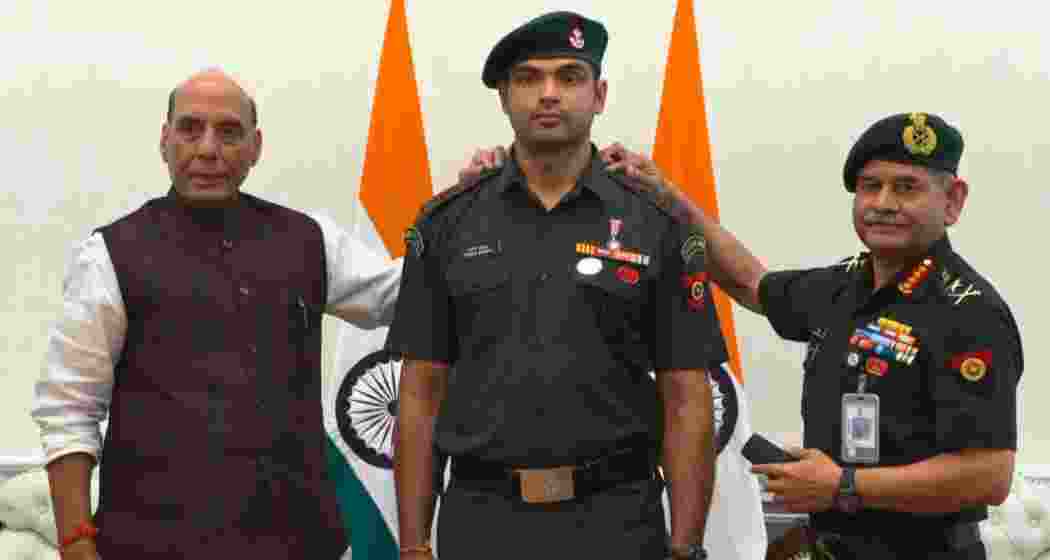 Olympic champion Neeraj Chopra receives the honorary rank of Lieutenant Colonel from Defence Minister Rajnath Singh and Army Chief Gen Upendra Dwivedi at a ceremony in New Delhi. Olympic champion Neeraj Chopra receives the honorary rank of Lieutenant Colonel from Defence Minister Rajnath Singh and Army Chief Gen Upendra Dwivedi at a ceremony in New Delhi.