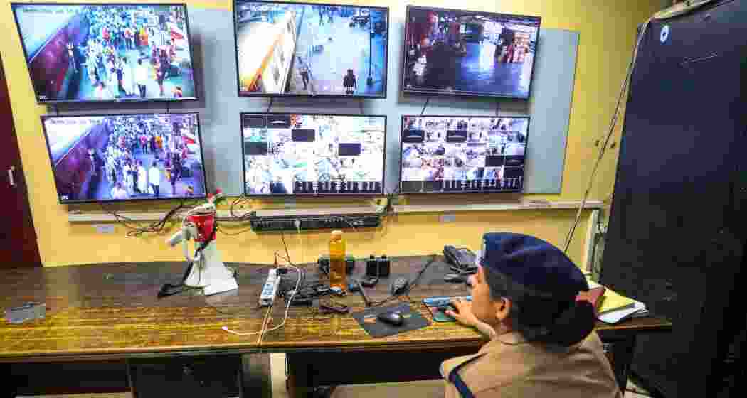 A police official keeps a vigil through CCTV cameras from a control room, ahead of the NEET-UG re-examination, at the Charbagh Railway Station, in Lucknow, Uttar Pradesh, on Saturday. A police official keeps a vigil through CCTV cameras from a control room, ahead of the NEET-UG re-examination, at the Charbagh Railway Station, in Lucknow, Uttar Pradesh, on Saturday.