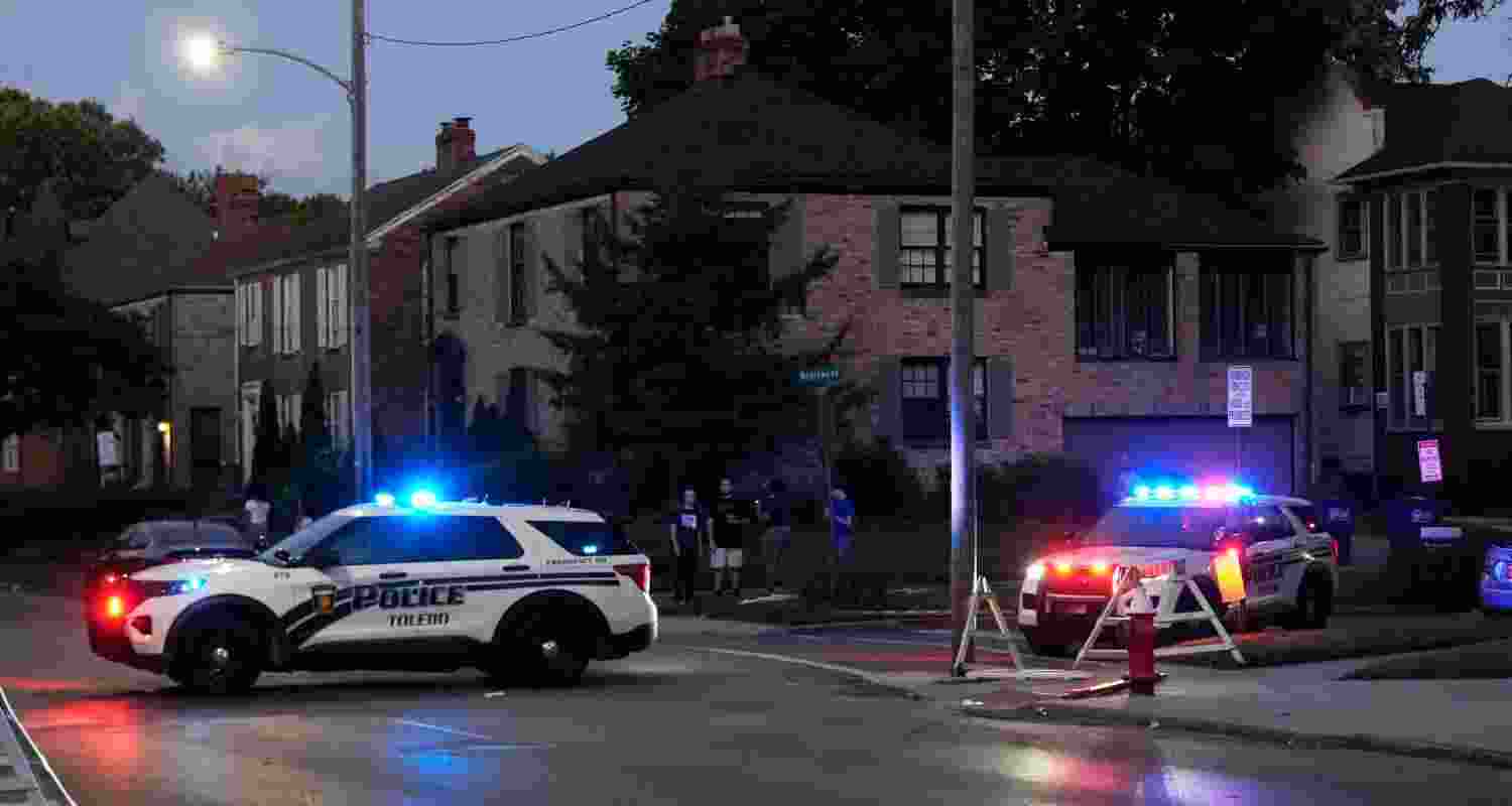 Police stand near where multiple people were shot at a community festival at the Agnes Reynolds Jackson Arboretum Saturday, June 6, 2026, in Toledo, Ohio. Police stand near where multiple people were shot at a community festival at the Agnes Reynolds Jackson Arboretum Saturday, June 6, 2026, in Toledo, Ohio.