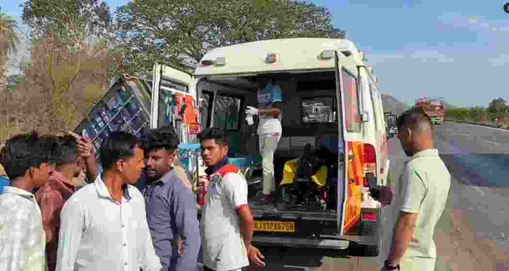Rescue personnel and local residents carry out rescue operations after a container truck collided with a tempo carrying wedding guests on the Mumbai-Ahmedabad National Highway in Maharashtra’s Palghar district on Monday. Rescue personnel and local residents carry out rescue operations after a container truck collided with a tempo carrying wedding guests on the Mumbai-Ahmedabad National Highway in Maharashtra’s Palghar district on Monday.
