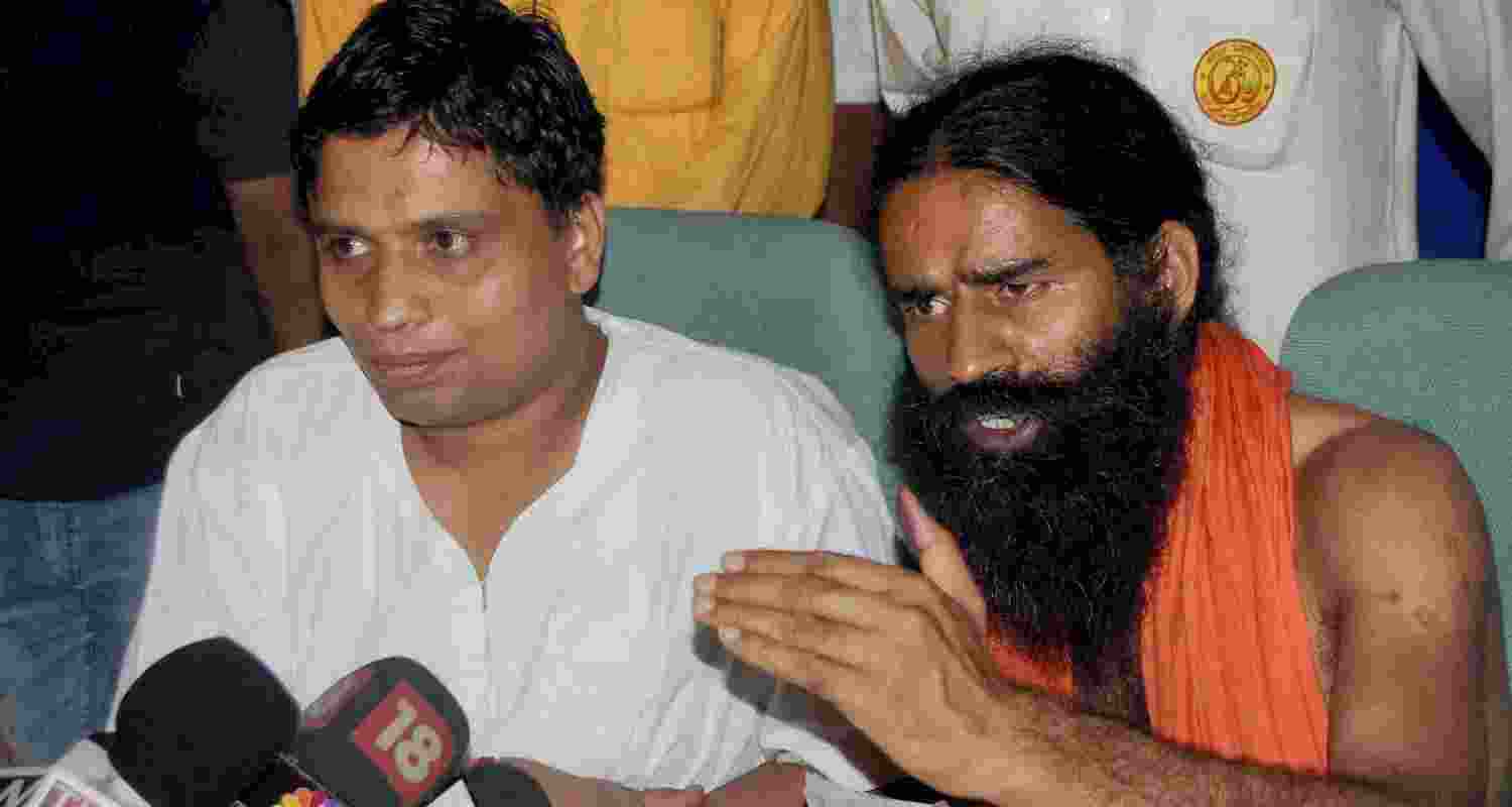 Ramdev and his close aide Balkrishna. Ramdev and his close aide Balkrishna.