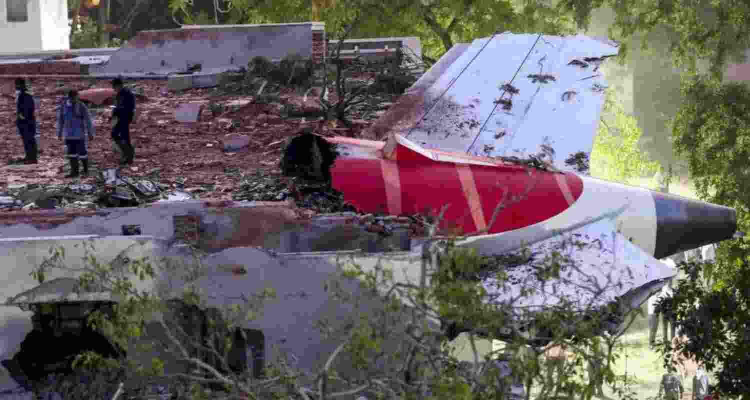 Remains of the Air India plane that crashed moments after taking off from the Ahmedabad airport, lies on a building in Ahmedabad, Thursday. Remains of the Air India plane that crashed moments after taking off from the Ahmedabad airport, lies on a building in Ahmedabad, Thursday.