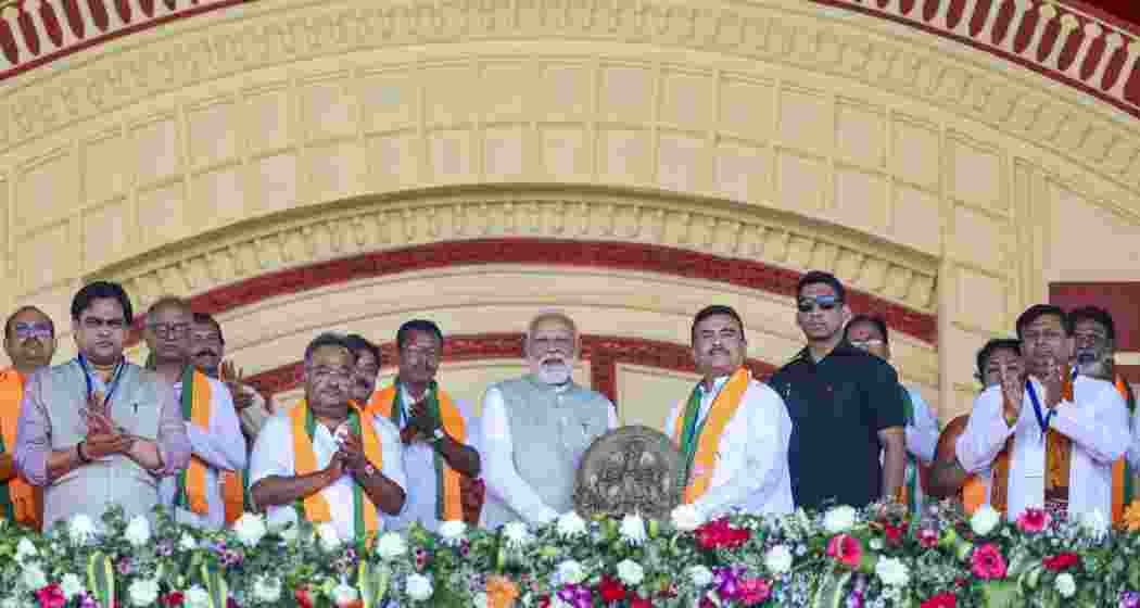 Prime Minister Narendra Modi being garlanded by West Bengal BJP President Samik Bhattacharya, LoP in the state Assembly Suvendu Adhikari during a rally, at Brigade Parade Ground in Kolkata, on Saturday. Prime Minister Narendra Modi being garlanded by West Bengal BJP President Samik Bhattacharya, LoP in the state Assembly Suvendu Adhikari during a rally, at Brigade Parade Ground in Kolkata, on Saturday.