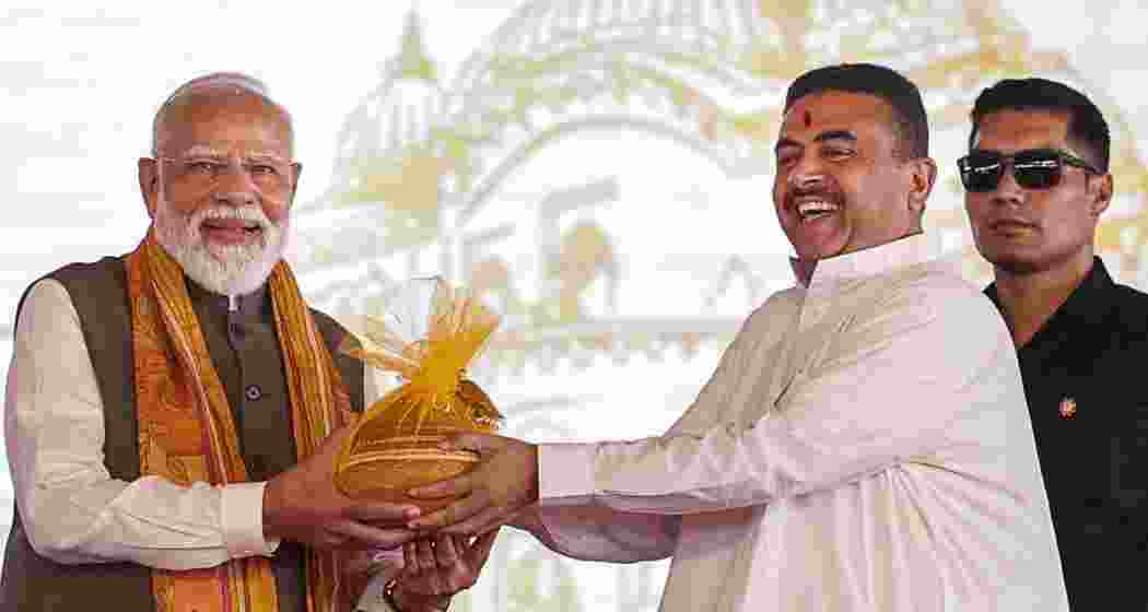 Prime Minister Narendra Modi being greeted by West Bengal Chief Minister Suvendu Adhikari during the 'Paschimbanga Divas', West Bengal Day, celebration at Tarakeswar, in Hooghly district, West Bengal on Saturday. Prime Minister Narendra Modi being greeted by West Bengal Chief Minister Suvendu Adhikari during the 'Paschimbanga Divas', West Bengal Day, celebration at Tarakeswar, in Hooghly district, West Bengal on Saturday.
