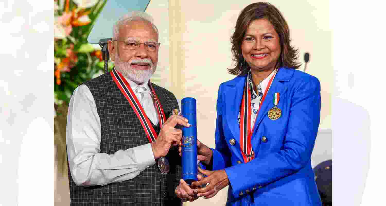 Prime Minister Narendra Modi being conferred with 'The Order of the Republic of Trinidad and Tobago' - the country's highest civilian honour, by Trinidad and Tobago President Christine Carla Kangaloo during a ceremony at the President�s House, in Trinidad and Tobago. Prime Minister Narendra Modi being conferred with 'The Order of the Republic of Trinidad and Tobago' - the country's highest civilian honour, by Trinidad and Tobago President Christine Carla Kangaloo during a ceremony at the President�s House, in Trinidad and Tobago.