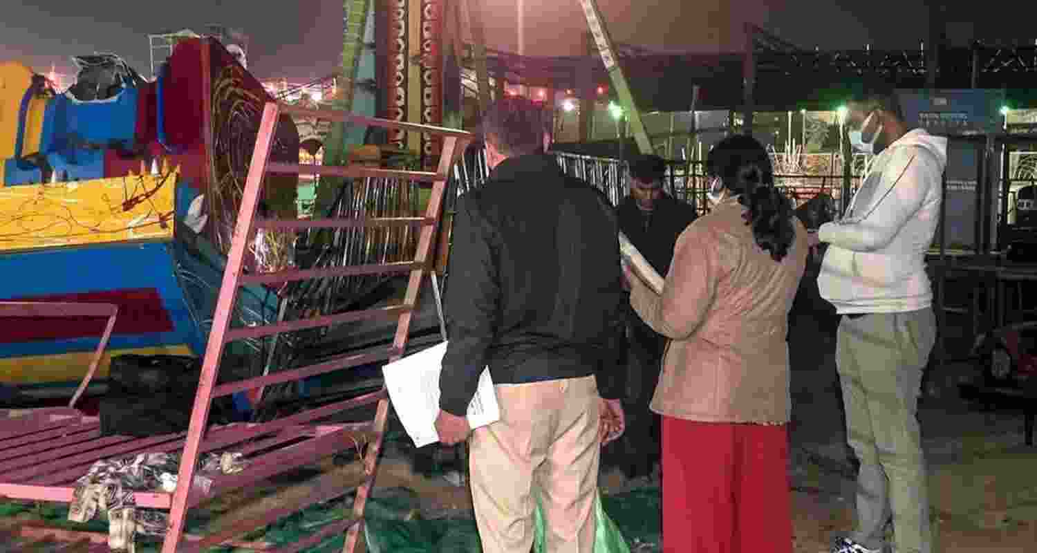 Police and forensic teams inspect site after swing collapse at Surajkund Mela in Faridabad on Saturday. Police and forensic teams inspect site after swing collapse at Surajkund Mela in Faridabad on Saturday.