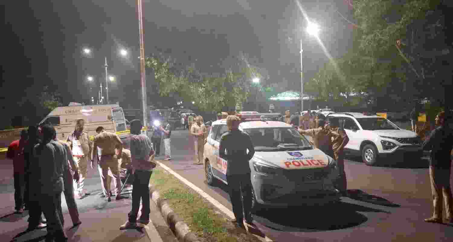 Police personnel at the spot after an exchange of fire near Sector 43 bus stand in Chandigarh.. Police personnel at the spot after an exchange of fire near Sector 43 bus stand in Chandigarh..