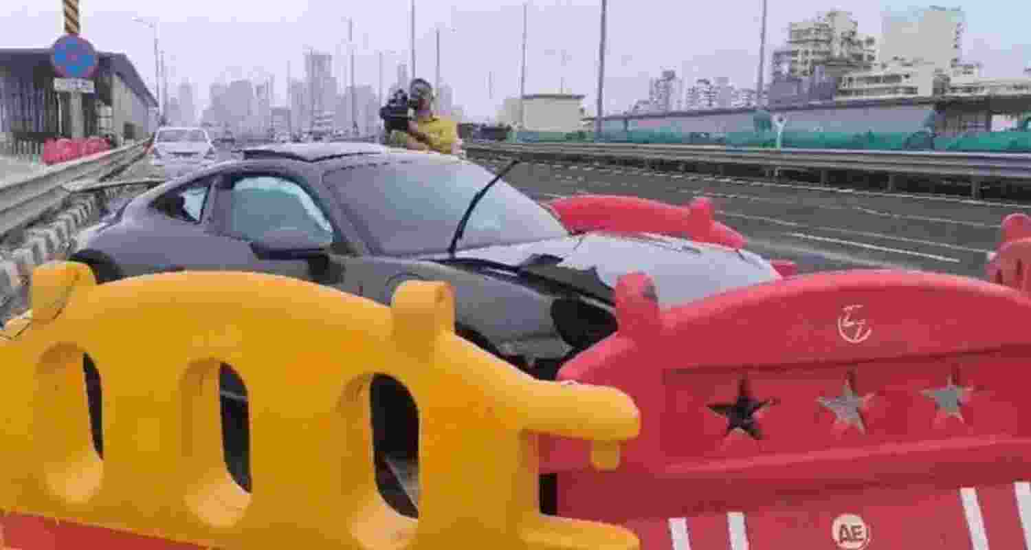 Speeding Porsche rams divider on Mumbai's coastal road Speeding Porsche rams divider on Mumbai's coastal road