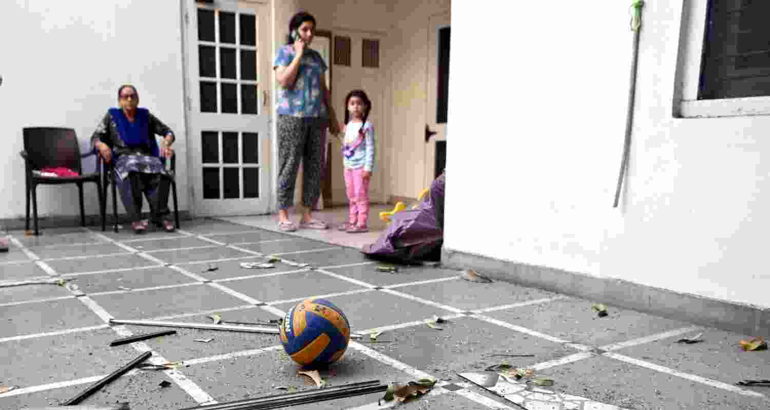 Family members in the house after a "blast" took place outside the residence of BJP leader Manoranjan Kalia, in Punjab's Jalandhar district, Tuesday. Family members in the house after a "blast" took place outside the residence of BJP leader Manoranjan Kalia, in Punjab's Jalandhar district, Tuesday.