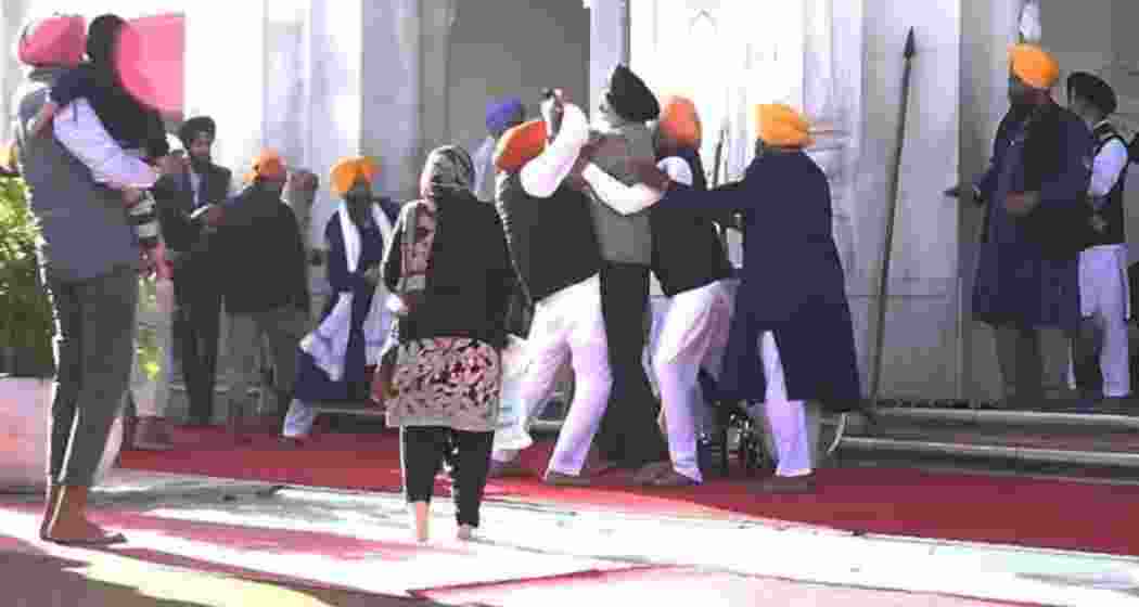 People catch a man who allegedly opened fire at Shiromani Akali Dal leader Sukhbir Singh Badal while the latter was serving the ’tankhah’ (religious punishment) given by the Akal Takht at the Golden Temple, in Amritsar on Wednesday, Dec. 4, 2024. People catch a man who allegedly opened fire at Shiromani Akali Dal leader Sukhbir Singh Badal while the latter was serving the ’tankhah’ (religious punishment) given by the Akal Takht at the Golden Temple, in Amritsar on Wednesday, Dec. 4, 2024.
