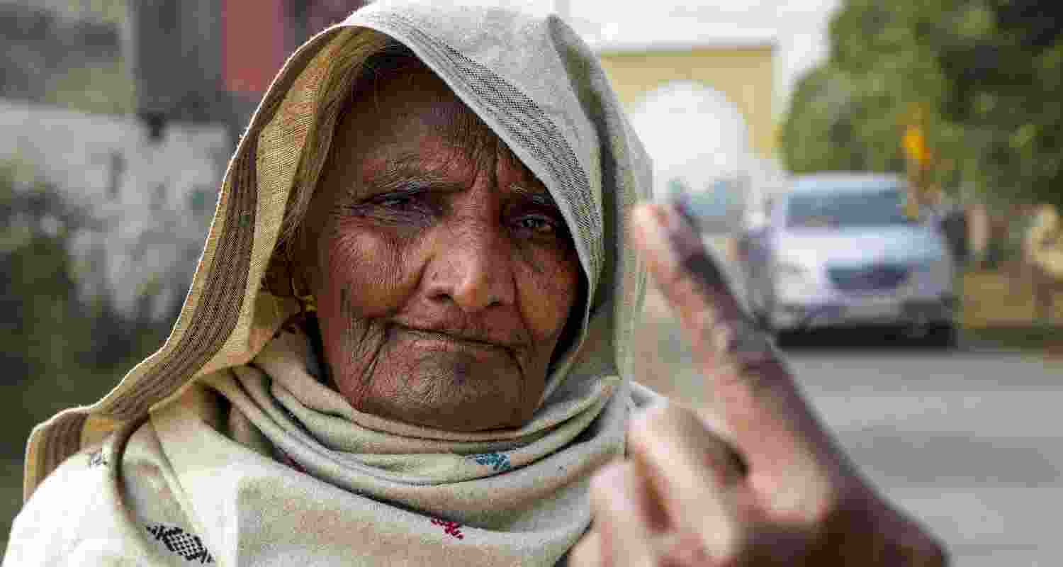 An elderly woman shows her ink marked finger after casting vote at a polling station during 'Zila Parishad' and 'Panchayat Samiti' elections, on the outskirts of Amritsar, Punjab, Sunday. An elderly woman shows her ink marked finger after casting vote at a polling station during 'Zila Parishad' and 'Panchayat Samiti' elections, on the outskirts of Amritsar, Punjab, Sunday.