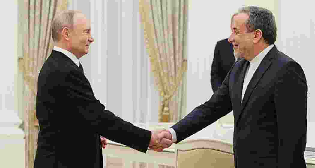 Russia's President Vladimir Putin shakes hands with Iran's Foreign Minister Abbas Araghchi during a meeting at the Kremlin in Moscow on April 17, 2025. Russia's President Vladimir Putin shakes hands with Iran's Foreign Minister Abbas Araghchi during a meeting at the Kremlin in Moscow on April 17, 2025.