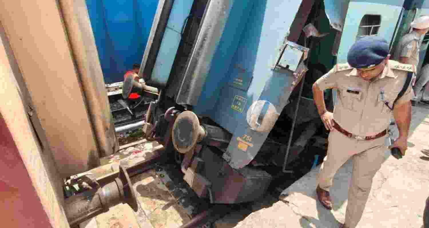 Railway officials inspect the damaged coach of a Katra-bound special train at Ludhiana on Saturday. Railway officials inspect the damaged coach of a Katra-bound special train at Ludhiana on Saturday.
