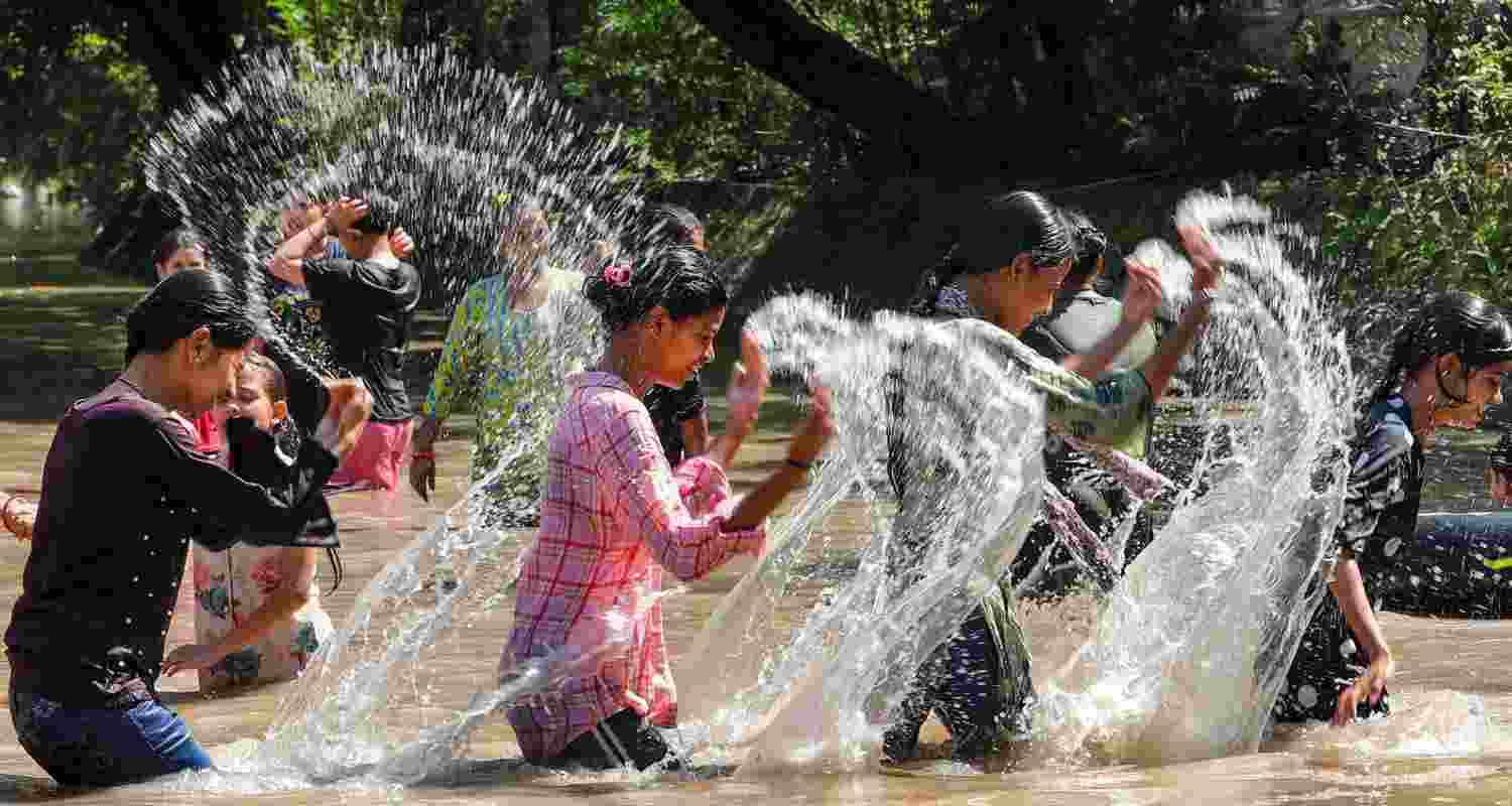 People bathe in the Ranbir canal during a hot summer day, in Jammu, Tuesday. People bathe in the Ranbir canal during a hot summer day, in Jammu, Tuesday.