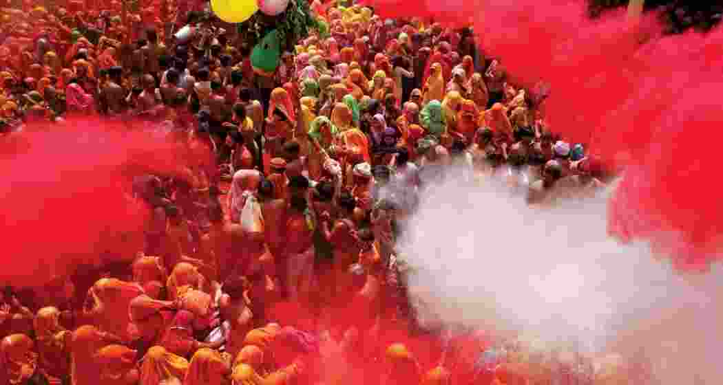 People celebrate the festival of Holi with colours and flower petals at the Shri Bankey Bihari Temple in Vrindavan on the occasion of Rangbhari Ekadashi. People celebrate the festival of Holi with colours and flower petals at the Shri Bankey Bihari Temple in Vrindavan on the occasion of Rangbhari Ekadashi.