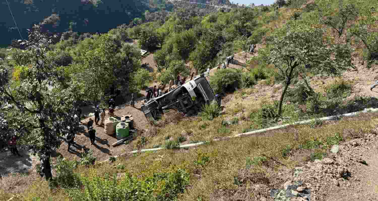 Rescue workers search the wreckage after a bus fell into a gorge in Tehri district, killing five and injuring several others. Rescue workers search the wreckage after a bus fell into a gorge in Tehri district, killing five and injuring several others.