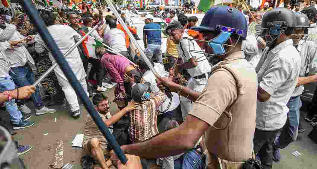 BJP members and security personnel clash during a protest organised to mark the completion of one year of the rape and murder of a trainee doctor at RG Kar hospital. BJP members and security personnel clash during a protest organised to mark the completion of one year of the rape and murder of a trainee doctor at RG Kar hospital.