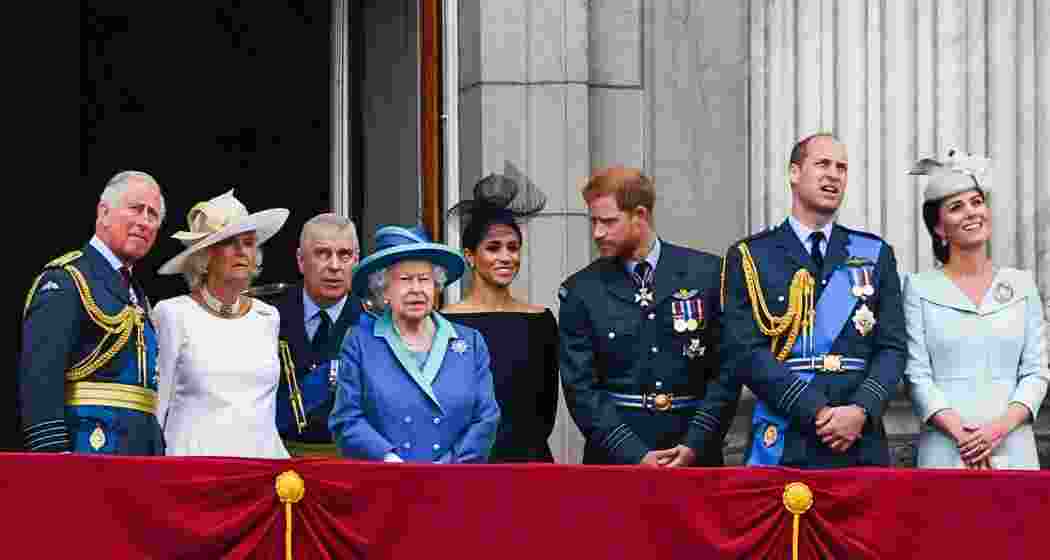 Prince Charles, Camilla, Duchess of Cornwall, Prince Andrew, Queen Elizabeth II, Meghan, Duchess of Sussex, Prince Harry, Prince William, and Catherine, Duchess of Cambridge, stand on the Buckingham Palace balcony to watch a flypast marking the centenary of the Royal Air Force on 10 July 2018 in London, England. Prince Charles, Camilla, Duchess of Cornwall, Prince Andrew, Queen Elizabeth II, Meghan, Duchess of Sussex, Prince Harry, Prince William, and Catherine, Duchess of Cambridge, stand on the Buckingham Palace balcony to watch a flypast marking the centenary of the Royal Air Force on 10 July 2018 in London, England.