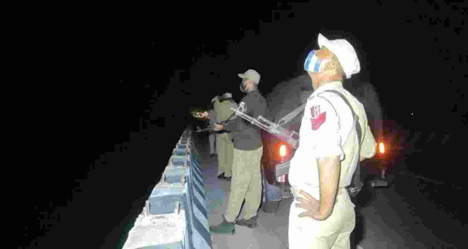 Cops observing movement of drone in Ghagwal area of Samba on Monday night. Cops observing movement of drone in Ghagwal area of Samba on Monday night.