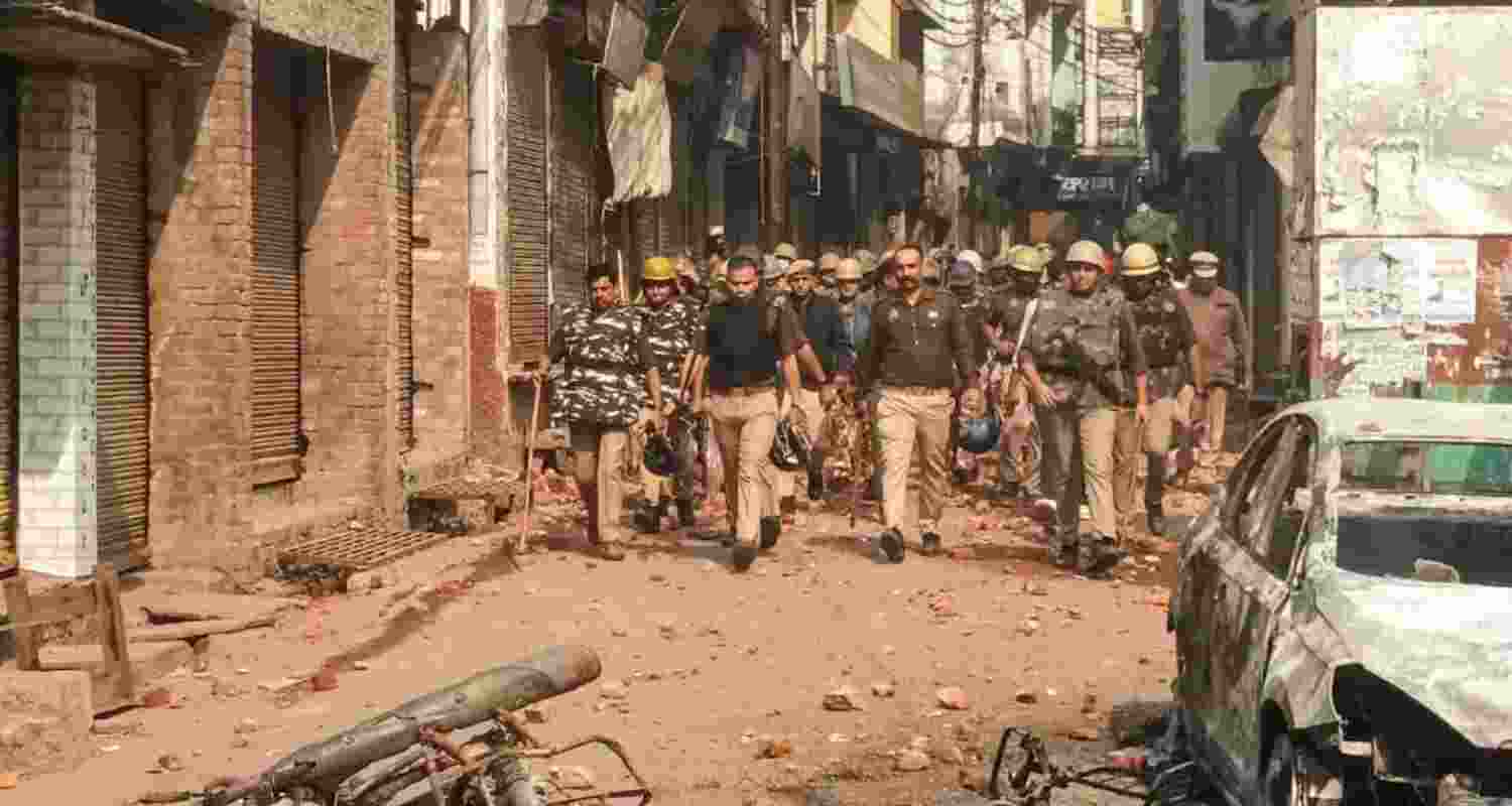 Police march during riots in Sambhal. Police march during riots in Sambhal.