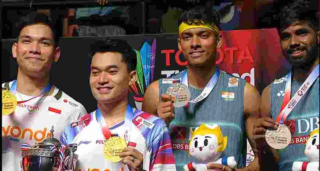 Satwiksairaj Rankireddy and Chirag Shetty, along with Indonesian pair Leo Rolly Carnando and Daniel Marthin, display their medals after the men’s doubles final of the Thailand Open Super 500 in Bangkok, where the Indian duo finished runners-up following a hard-fought contest. Satwiksairaj Rankireddy and Chirag Shetty, along with Indonesian pair Leo Rolly Carnando and Daniel Marthin, display their medals after the men’s doubles final of the Thailand Open Super 500 in Bangkok, where the Indian duo finished runners-up following a hard-fought contest.