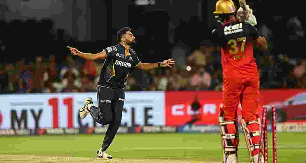 Mohammed Siraj celebrates after claiming a wicket during Gujarat Titans' IPL clash against Royal Challengers Bengaluru. Mohammed Siraj celebrates after claiming a wicket during Gujarat Titans' IPL clash against Royal Challengers Bengaluru.