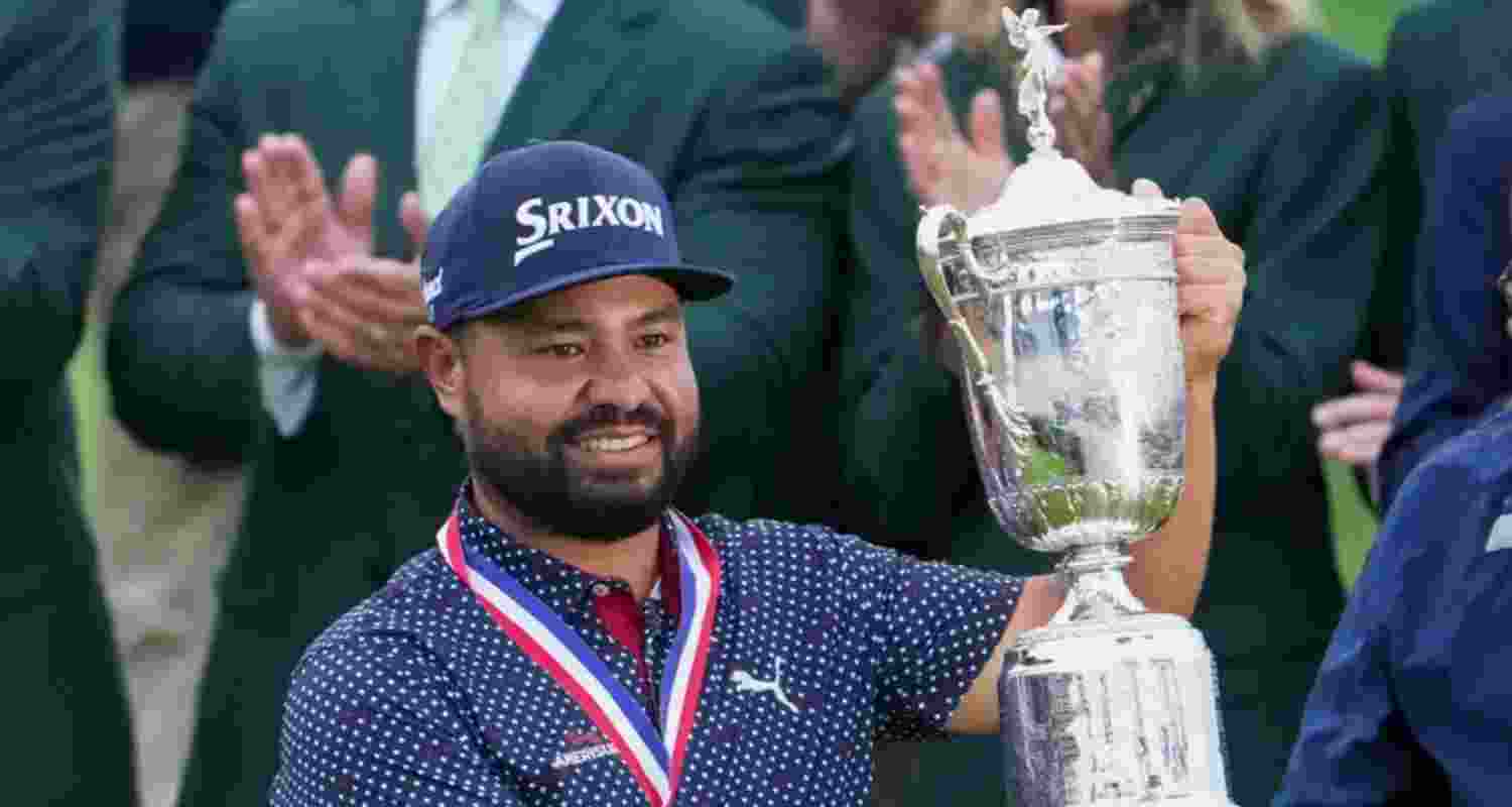 JJ Spaun celebrates with the trophy after winning the US Open golf tournament in Oakmont, USA. JJ Spaun celebrates with the trophy after winning the US Open golf tournament in Oakmont, USA.