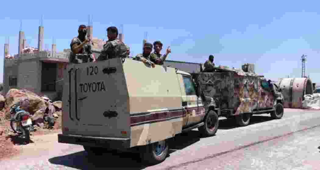 Syrian government security forces gather on the outskirts of Sweida province where clashes erupted between Druze militias and Sunni Bedouin clans, southern Syria, Monday, July 14, 2025. Syrian government security forces gather on the outskirts of Sweida province where clashes erupted between Druze militias and Sunni Bedouin clans, southern Syria, Monday, July 14, 2025.
