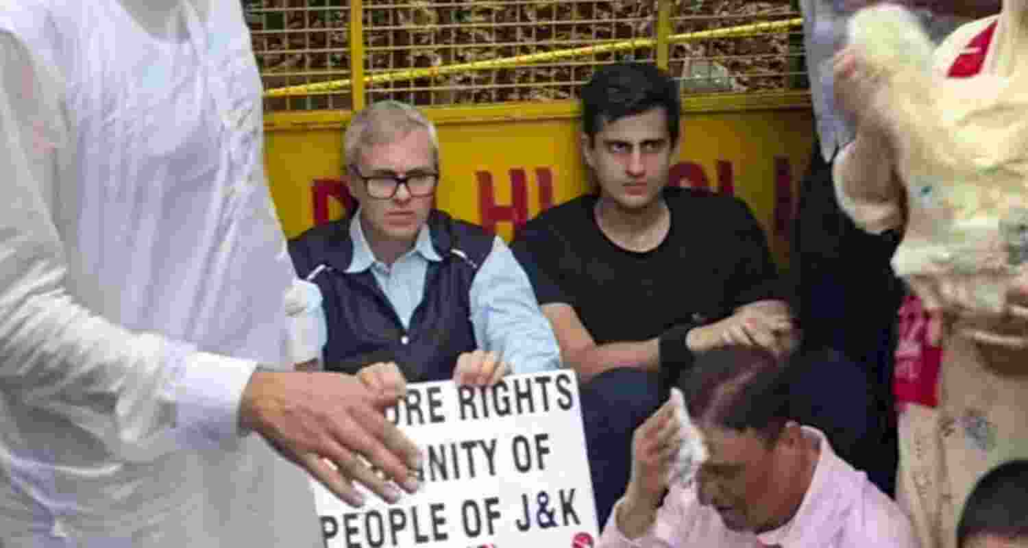 Jammu and Kashmir Chief Minister Omar Abdullah sitting on a road during a protest march demanding the restoration of statehood in Jammu and Kashmir, in New Delhi on Monday. Jammu and Kashmir Chief Minister Omar Abdullah sitting on a road during a protest march demanding the restoration of statehood in Jammu and Kashmir, in New Delhi on Monday.