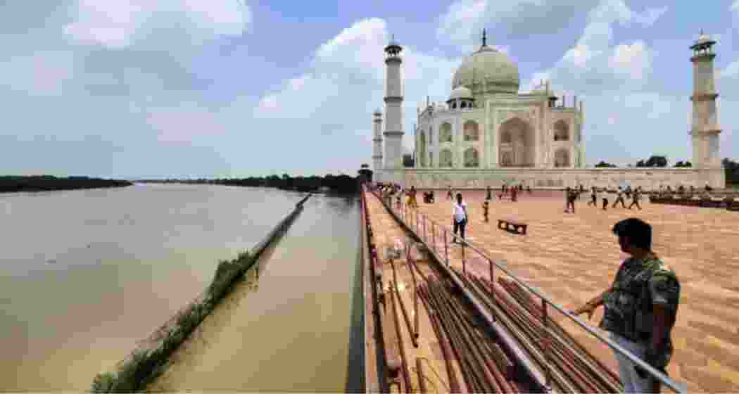 Flood-swollen Yamuna waters reach the walls of the Taj Mahal in Agra. Flood-swollen Yamuna waters reach the walls of the Taj Mahal in Agra.