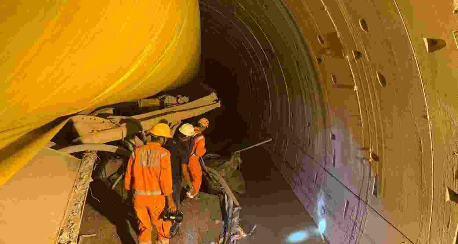 Rescue personnel inside the collapsed tunnel. Image via X. Rescue personnel inside the collapsed tunnel. Image via X.