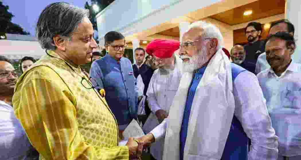 Prime Minister Narendra Modi greets Congress MP Shashi Tharoor. (File photo) Prime Minister Narendra Modi greets Congress MP Shashi Tharoor. (File photo)